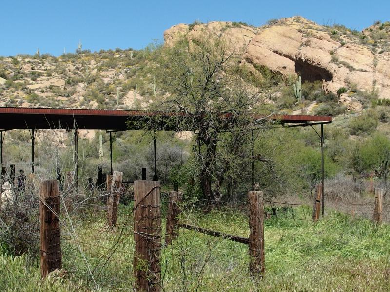 A rusty, shaded shelter at the ranch