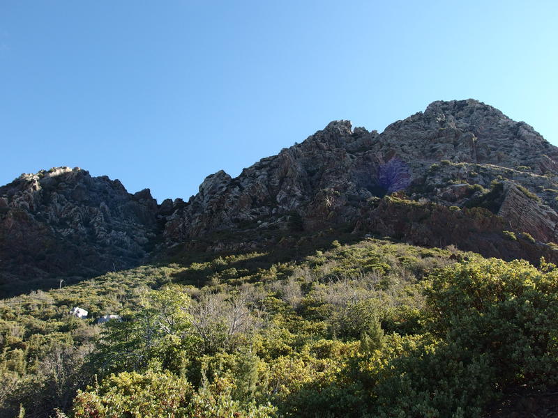 Sun beginning to light up the peaks above