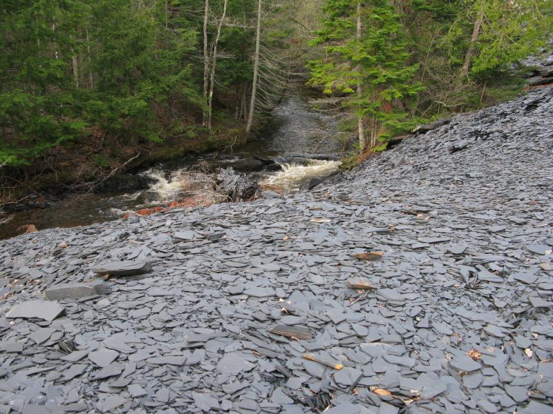 Slate spilling down into the river