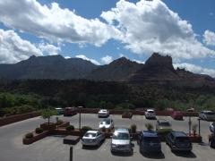 Rugged hills and mountains beyond tame parking