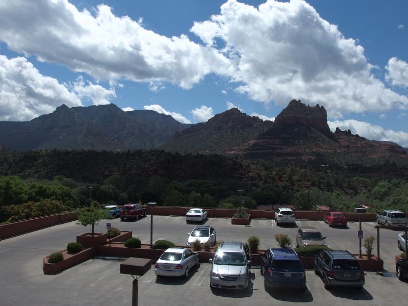 Rugged hills and mountains beyond tame parking