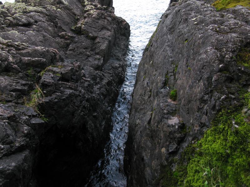 Narrow watery crack in the rock
