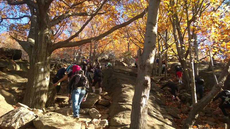 Bottleneck of slow hikers on the steep slope