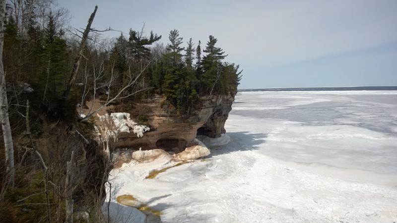 Precarious sea caves below