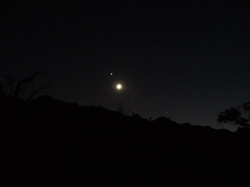 Crescent moon shining over Bluff Springs Mountain