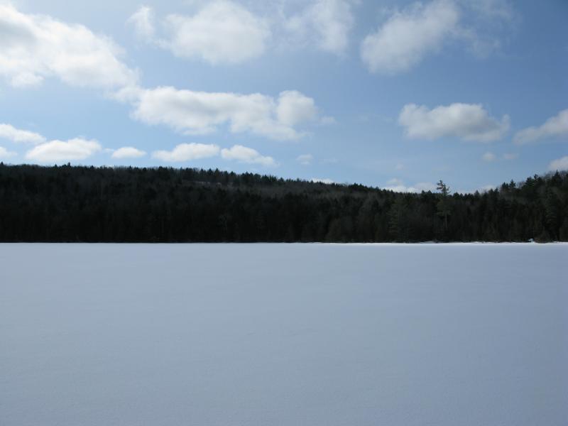 Ice Covered Cliff Lake