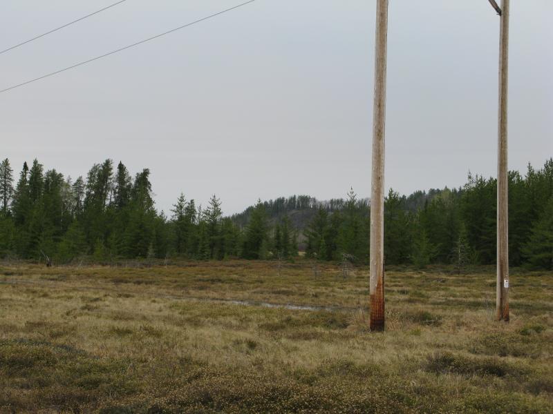 Northwest at the distant, already-scaled bluff