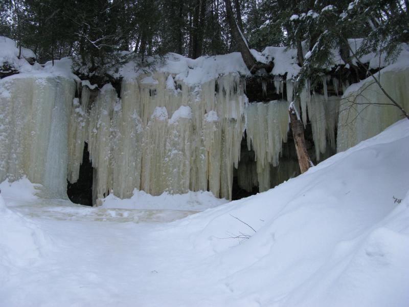Walls of icicles over the rock