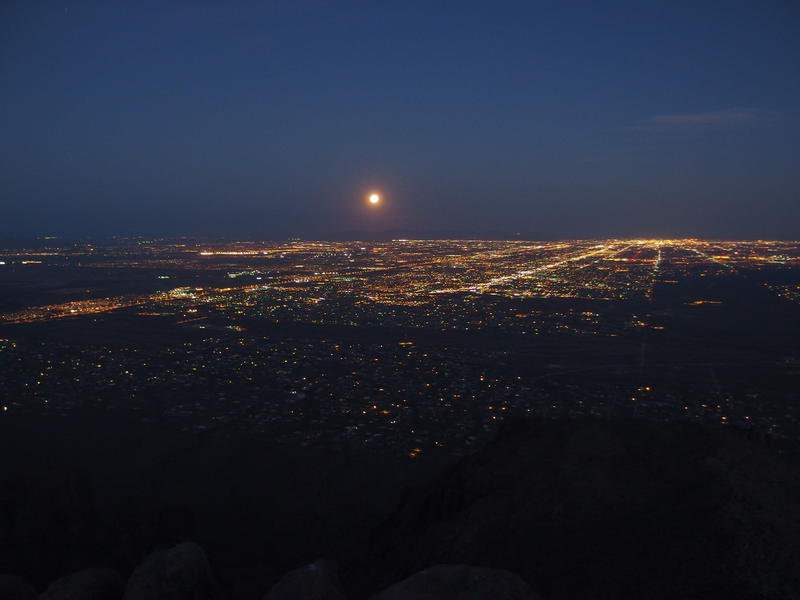 The full moon dropping down over Phoenix