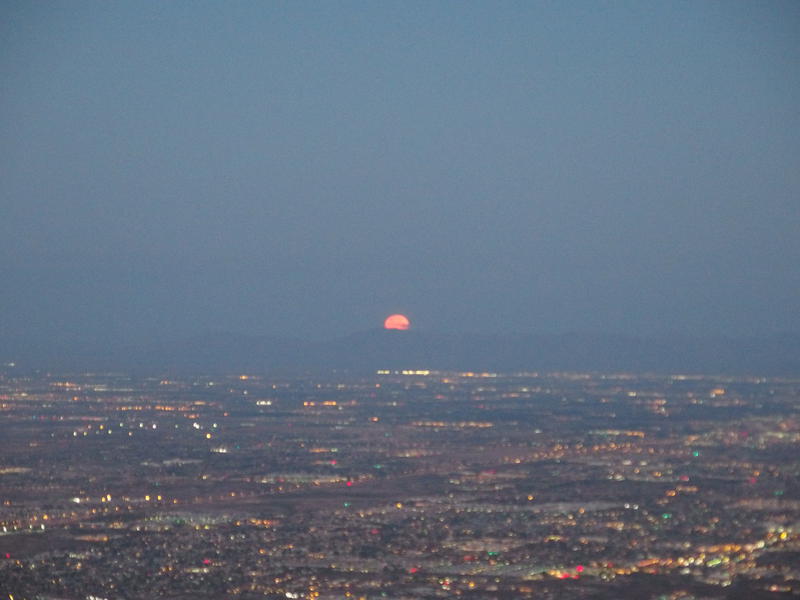 Moon dropping down behind Sierra Estrella