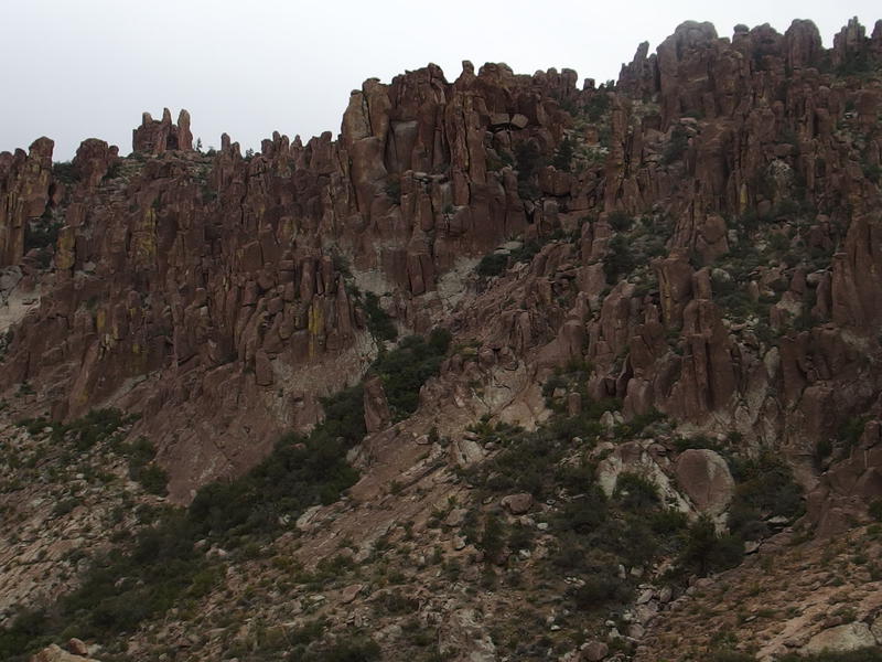 Rugged rock walls to the west of the canyon