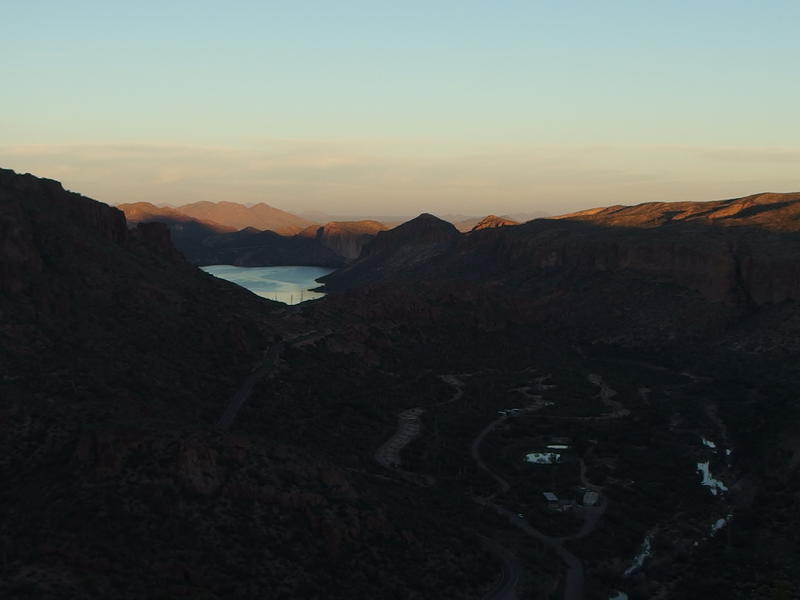 Sun creeping towards Canyon Lake and Tortilla Flat