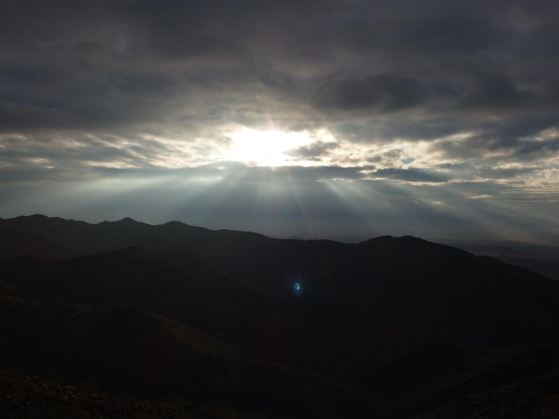 Morning sun rays over the ridges