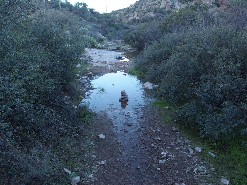 A lonely cairn, trying to lure me into the puddle