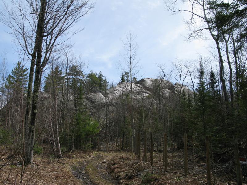 The bald spur of Migisy Bluff surrounded by fence 