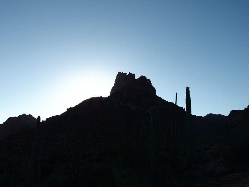 Sun hiding behind the needle