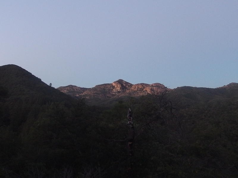 Dim morning light on a distant white mountain