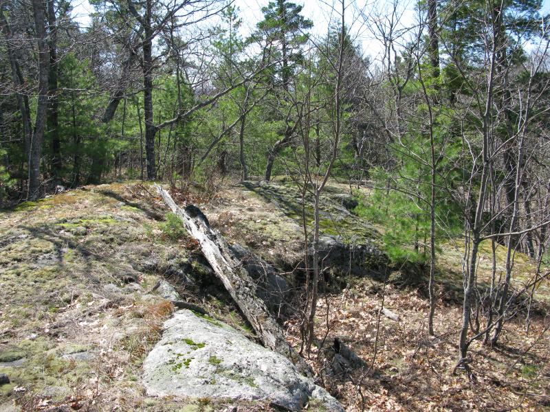 Odd rocky lump nestled between the two highpoints 