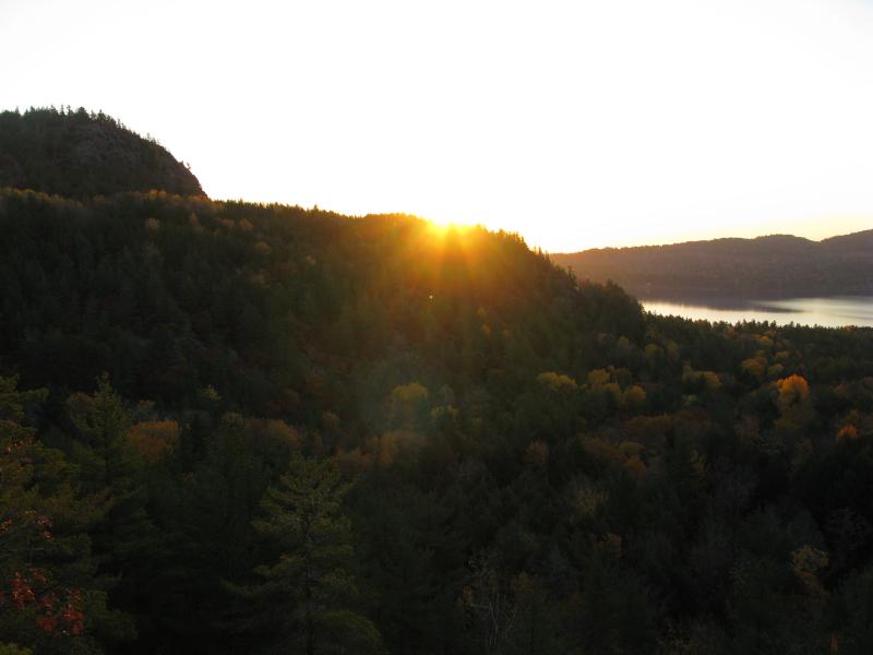 Sunrise peaking over Mount Ives