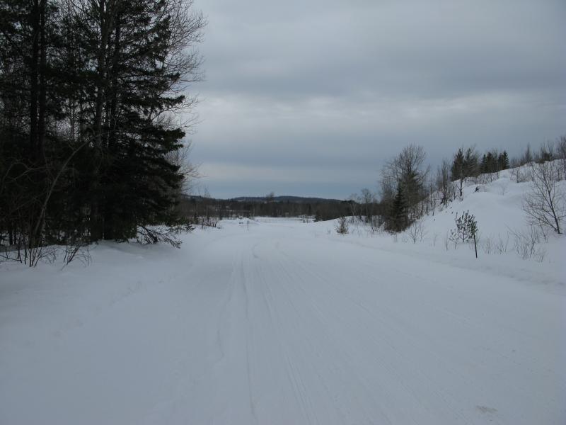 On a road, west of the grounds