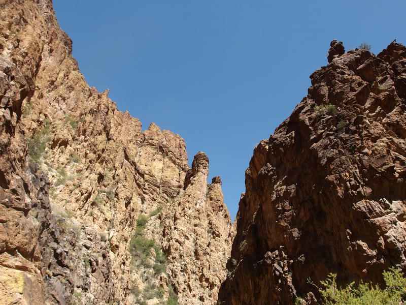 The tall, sun-baked cliffs around the canyon