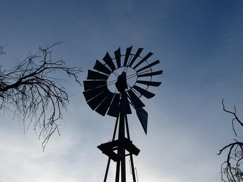 Windmill against the darkening sky