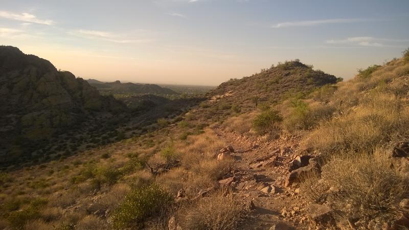 A slowly curving trail along the hillside