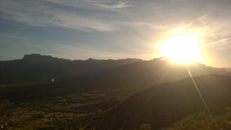 Sun poking out over South Peak in the Superstitions