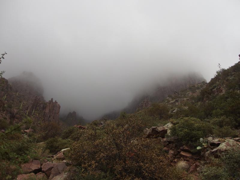 Clouds cloaking the rocks above