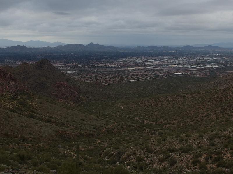 A long, winding trail below